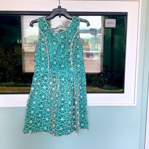Small floral overlay teal dress.
